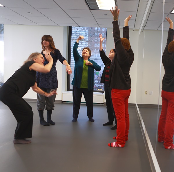 group of females in a dance/movement therapy class
